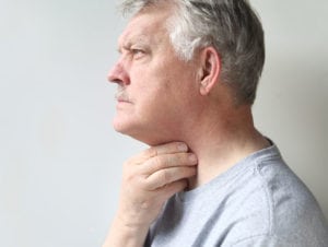 Man-Experiencing-Throat-Discomfort-Cause-by-Thyroid-Nodules