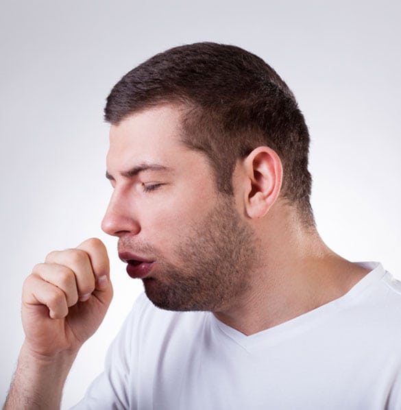 Man-With-Laryngitis-Experiencing-Dry-Coughs