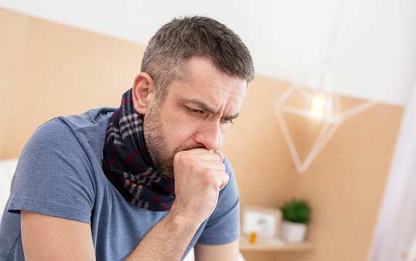 Man-with-Fever-and-Sore-Throat-Caused-by-Tonsillitis