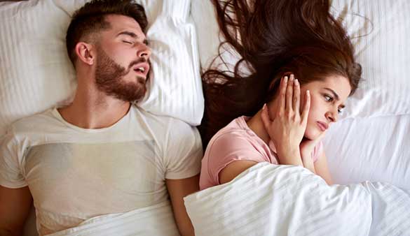 Woman-Suffering-from-Her-Husband's-Chronic-Snoring
